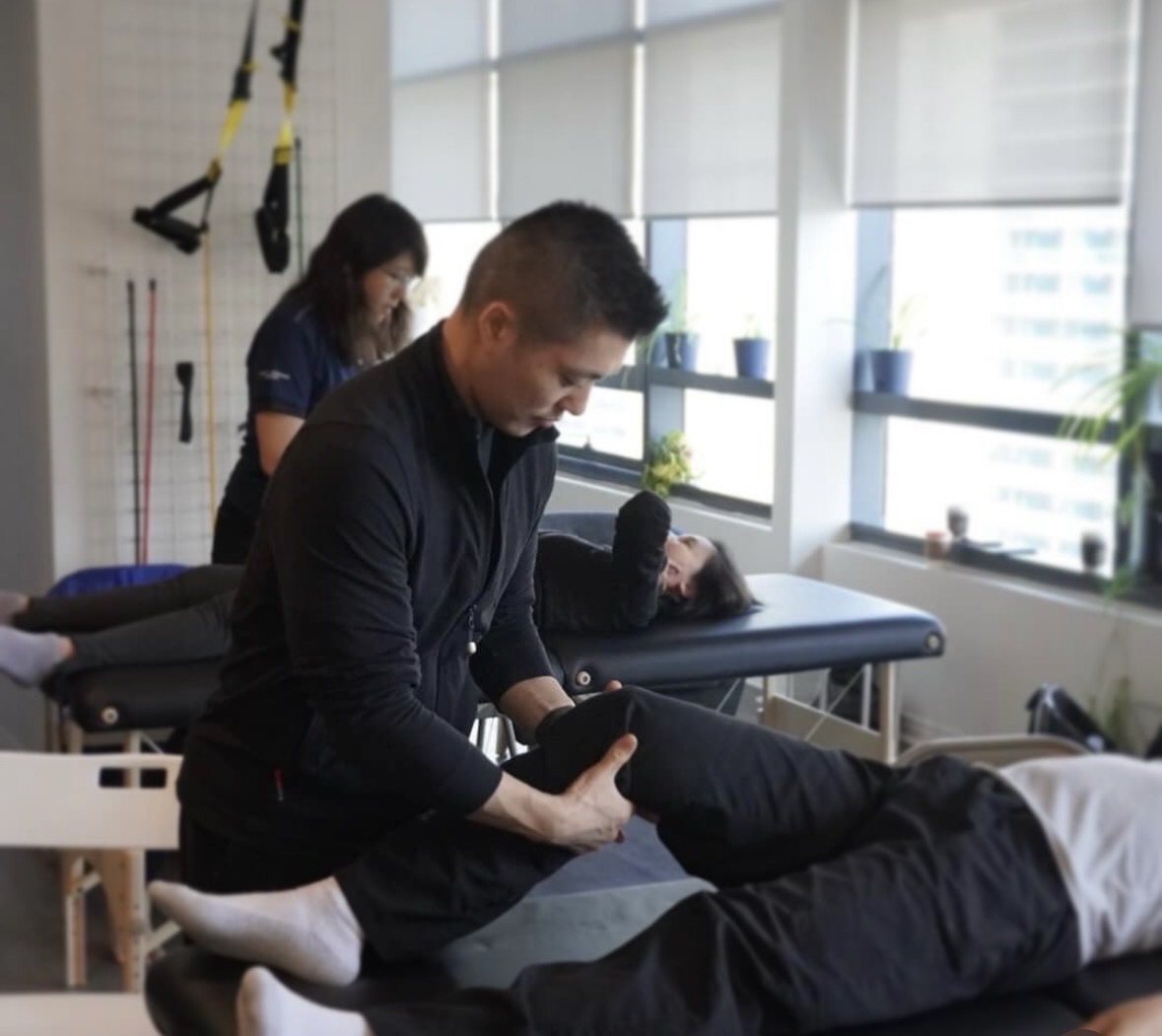 Min Moo (Steve) Lee providing hands-on Registered Massage Therapy treatment
